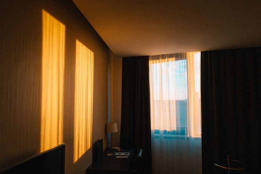 Morning sunlight coming through a window onto a wooden floor